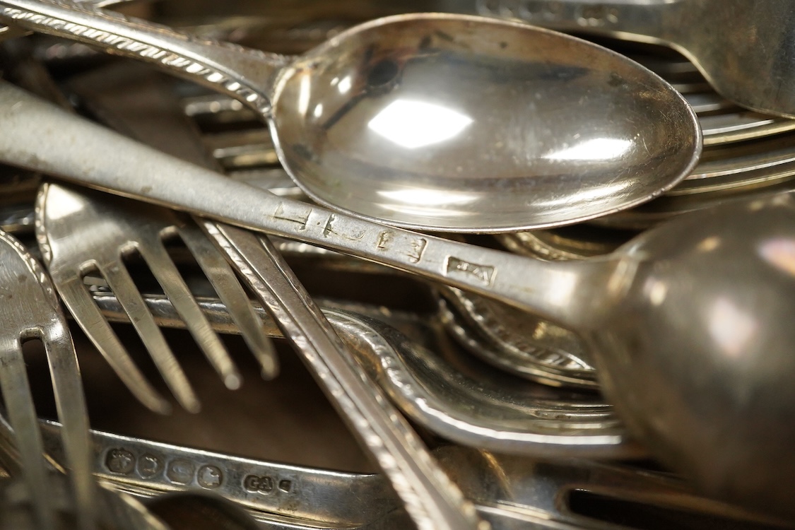 A part canteen of Victorian silver Old English pattern feather edge flatware, by George Adams, comprising twelve table forks, nine dessert forks and nine dessert spoons, London, 1861, together with ten earlier similar de